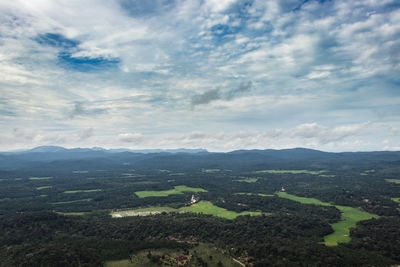 Mountain horizon coverd with cloud layers and forests