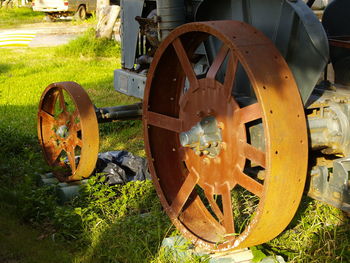 Close-up of machine part on field