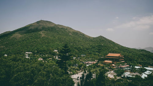 High angle view of houses and trees against sky