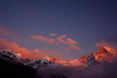 Scenic view of mountains against sky during sunset