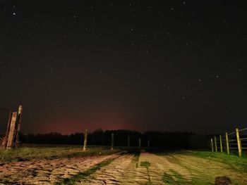 Scenic view of field against sky at night