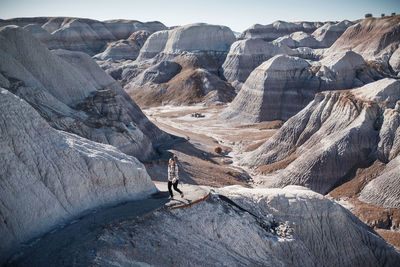 High angle view of woman hiking on mountain