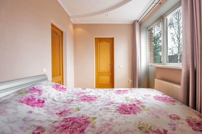 Pink flowers on bed of house