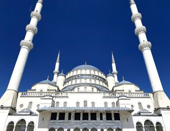 Low angle view of mosque against sky