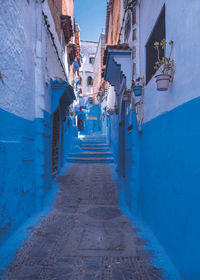 Narrow alley amidst buildings in city