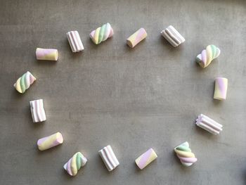 Directly above shot of multi colored candies on table