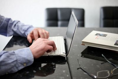 Man using laptop on table