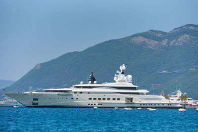 Luxury yacht is moored against the backdrop of mountains in montenegro