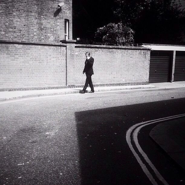 WOMAN WALKING ON ROAD