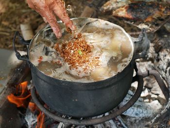 Close-up of person hand preparing food