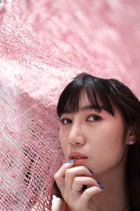 Close-up portrait of young woman looking away