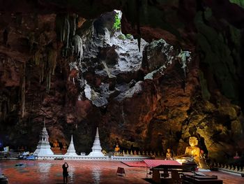 Statue of buddha in cave