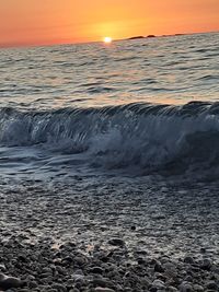 Scenic view of sea against sky during sunset