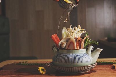 Close-up of food in kettle on table