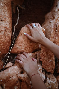 Cropped image of man holding hands