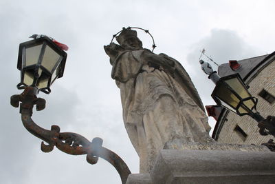 Low angle view of street light against sky