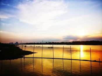 Scenic view of lake against sky during sunset