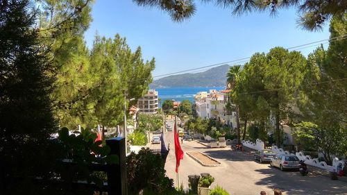 Panoramic view of city by sea against sky