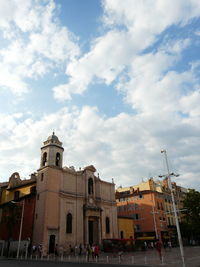 Low angle view of buildings in city against sky