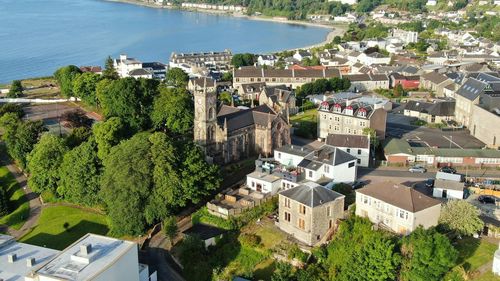 High angle view of townscape by sea