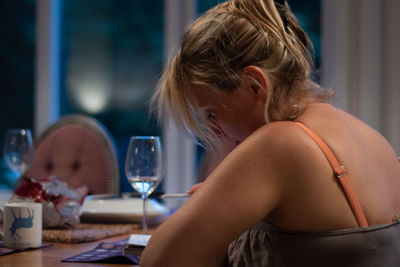 Portrait of woman sitting at home