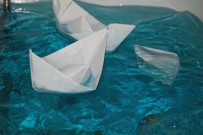 High angle view of paper floating on water