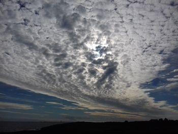 Low angle view of cloudy sky during sunset