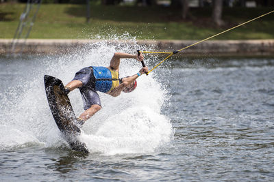 Man surfing in lake 