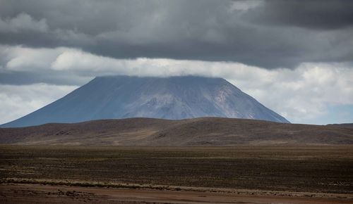 Scenic view of volcanic mountain against sky