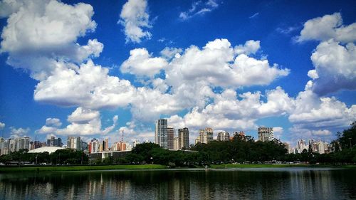 Cityscape against cloudy sky