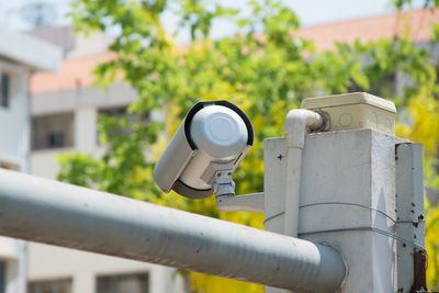 Close-up of coin-operated binoculars against blurred background