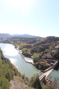 High angle view of river amidst landscape against clear sky