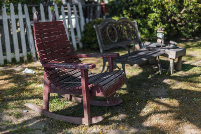 Empty chairs and tables at sidewalk cafe