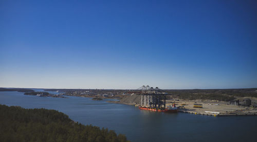 Scenic view of sea against clear blue sky with a ship