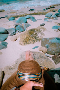 High angle view of woman at beach during sunny day