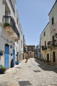 A small street in casamassima, a village with blue-colored houses in the puglia region of italy.