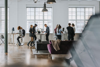 Male and female business colleagues planning strategy while working together at office