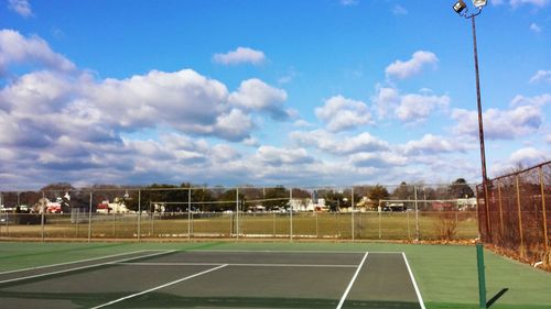 Scenic view of soccer field against sky