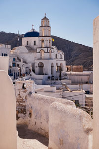 The church of christ - blue dome and bell tower - pyrgos village, santorini island, greece