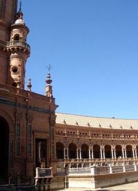 Low angle view of building against clear blue sky