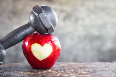 Close-up of red heart shape on table