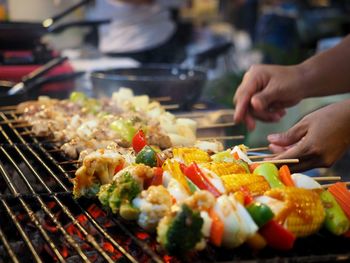 Man grilling shish kebabs