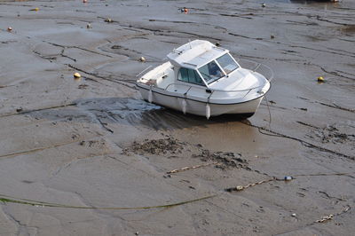 High angle view of boat moored on sand