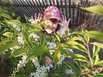 Portrait of smiling girl with plants