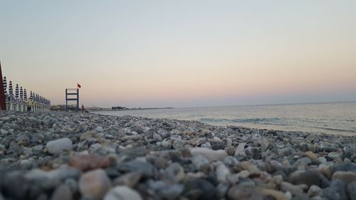 Scenic view of sea against clear sky during sunset