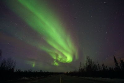 Scenic view of landscape against sky at night