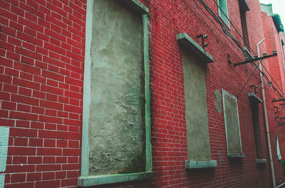 Red window on brick wall