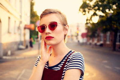 Portrait of young woman in sunglasses