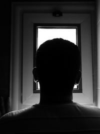 Rear view of shirtless man