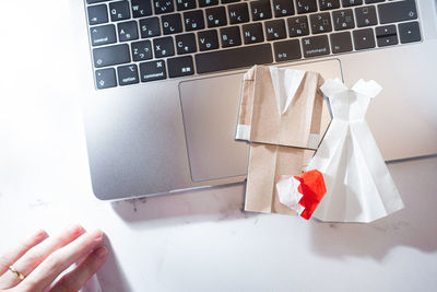 High angle view of person using laptop on table